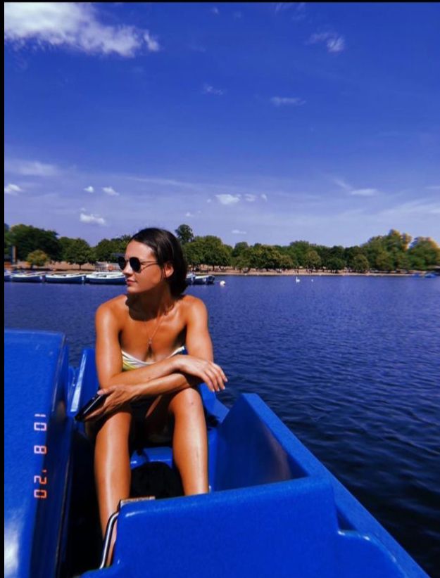 Woman Relaxing on a Sunny Day in a Boat